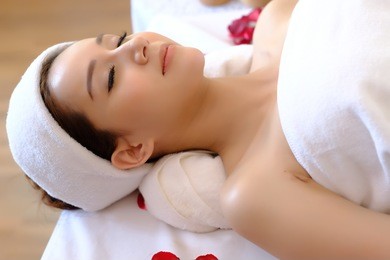  happy relaxing asian girl at beauty spa treatment. spa concept.