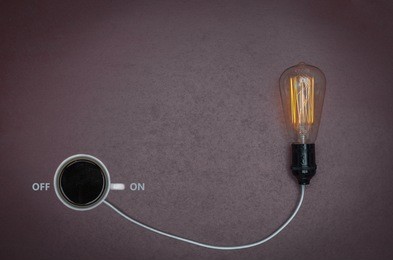 great concept of caffeine energy, coffee energy. cup of coffee binding lamp.
