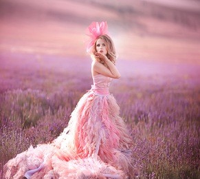 beautiful young woman in the lavender fields. pink skirt , a good mood . provence .