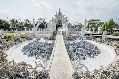 wat rong khun (white temple) - art exhibit in the style of a buddhist temple in chiang rai province, thailand