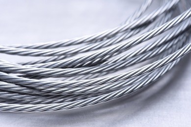 steel wire rope closeup on grey metal surface