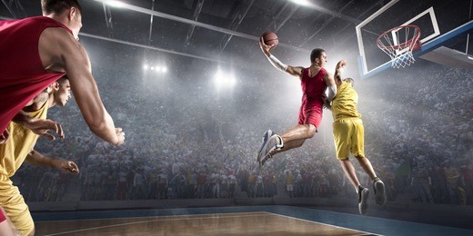 basketball players on big professional arena during the game. players fight for the ball. they are wearing unbrand clothes.