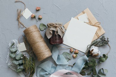 a wedding concept. invitation and items on a grey stone background.