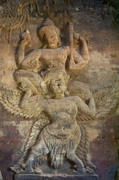 relief of vishnu on garuda carved directly out of the brick walls of prasat kravan, an ancient hindu temple at angkor in cambodia