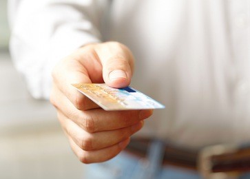 hand with credit card. shallow dof