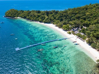 aerial view or top view of tropical island beach with clear water at banana beach, coral island, koh hey, phuket, thailand