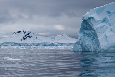 a bright clue iceberg in antarctica