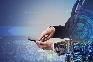 businessman touching smartphone with digital technology layer effect