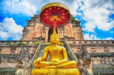 pagoda and buddha statue at wat chedi luang temple in chiang mai  thailand