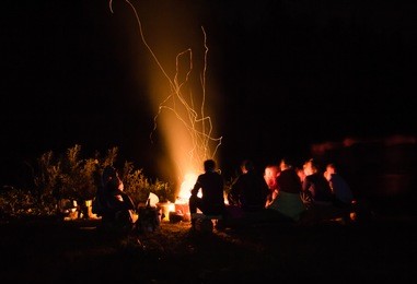 beautiful scenery of night view. bonfire around people,
bask near the fire, the concept of recreation