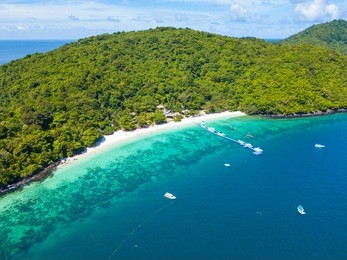 aerial view or top view of tropical island beach with clear water at banana beach, coral island, koh hey, phuket, thailand