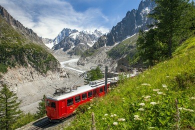 a red train in european alps, france