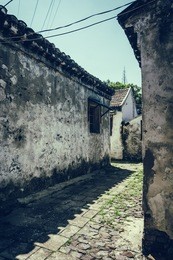 road and houses in xidi - road and houses in xidi, anhui, china, is shown in circa dec. 2011, which is famous for its kept old style village inclusive road, houses.