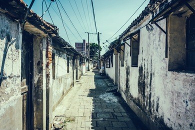 road and houses in xidi - road and houses in xidi, anhui, china, is shown in circa dec. 2011, which is famous for its kept old style village inclusive road, houses.