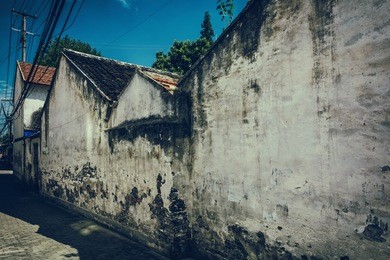 road and houses in xidi - road and houses in xidi, anhui, china, is shown in circa dec. 2011, which is famous for its kept old style village inclusive road, houses.