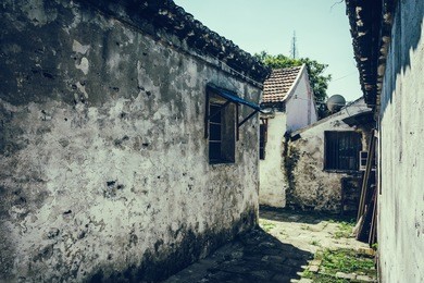 road and houses in xidi - road and houses in xidi, anhui, china, is shown in circa dec. 2011, which is famous for its kept old style village inclusive road, houses.