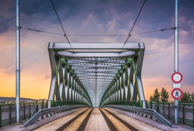 perspective view of old bridge in bratislava, slovakia at sunset