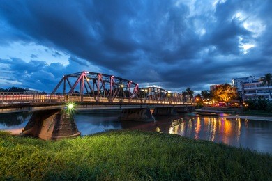 the color of the lights on the iron bridge in chiang mai, thailand.