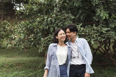 a portrait of a young man and woman couple have fun, enjoy holiday, happy life, love at mountain. pre-wedding concept.
