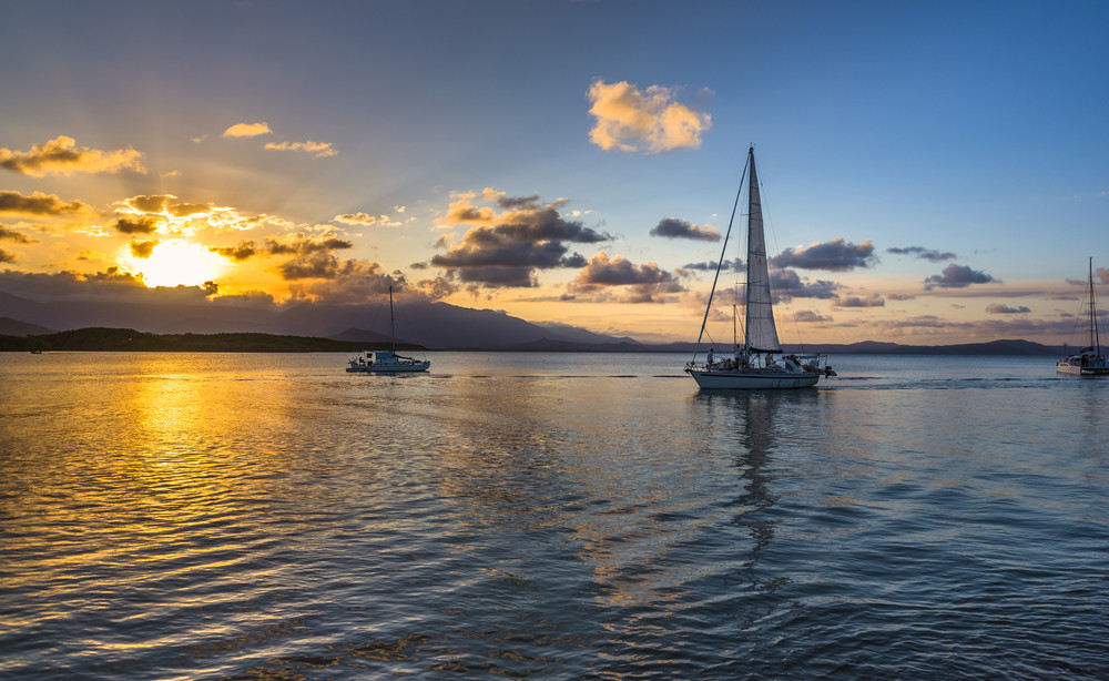 coral sea sunset harbour cruise sunburst reflections port douglas great barrier reef