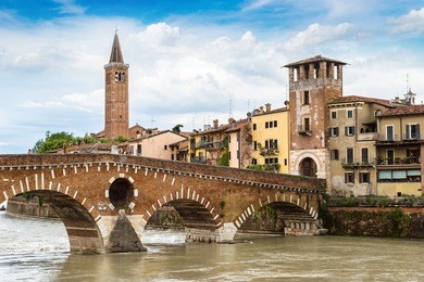 adige river and bridge ponte di pietra in verona in a beautiful summer day, italy