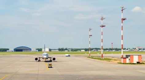 company car, at the airport showing the plane path of travel to a parking lot.