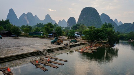 pier on the yulong river between a weird mountains in yangshuo, china. 