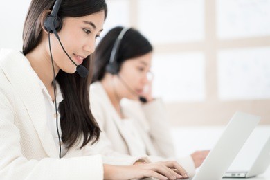 asian young woman working in call centre