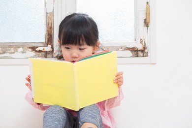 asian beautiful girl reading a book
