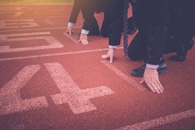 group of business people ready to start the race in track. business challenge concept.