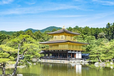 beautiful architecture at kinkaku-ji (temple of the golden pavilion), officially named rokuon-ji (deer garden temple), a zen buddhist temple in kyoto, japan. kinkakuji temple under blue cloudy sky day