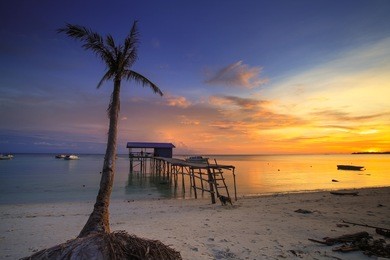 sunset at mantanani island, sabah, north borneo. the mantanani islands form a small group of three islands off the north-west coast of the state of sabah, malaysia, east malaysia. 
