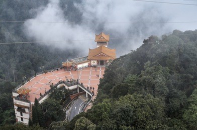 overlooking view of chin swee cave temple in genting highlands, malaysia. the temple is situated in the most scenic site of genting highlands with breathtaking view of rainforest. 
