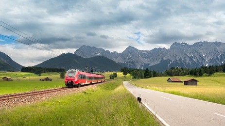karwendel mountain panorama with modern train in the foreground of the picture near mittenwald, bavaria, germany
