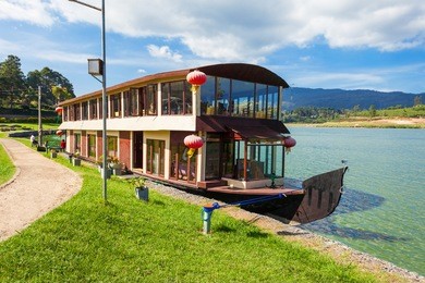houseboat at the gregory lake in nuwara eliya. lake gregory is a reservoir in centre of the tea country hill city nuwara eliya in sri lanka.