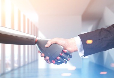 close up of a businessman in a suit and a robot shaking hands. office background. concept of innovation in business. toned image