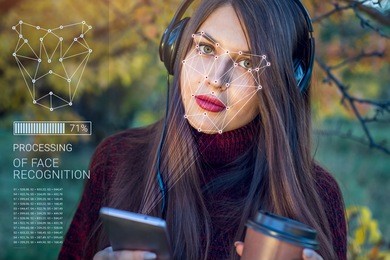 biometric verification. modern young woman with the phone. the concept of a new technology of face recognition on polygonal grid is constructed by the points of it security and protection id