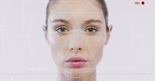 futuristic and technological scanning of the face of a beautiful woman for facial recognition and scanned person. it can serve to ensure personal safety. concept of:  future, security, scanning.