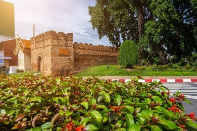 chiang mai gate old city ancient wall and moat (thai language: pra tu chiang mai) in chiang mai northern thailand.