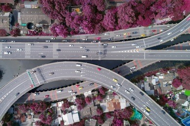 aerial view at junctions of city highway. vehicles drive on roads. thailand