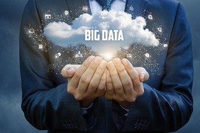 businessman showing the big data cloud on blue background.