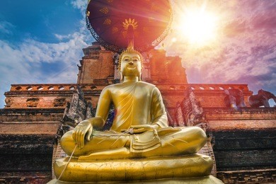 buddha and chedi in wat chiang man, chiang mai, thailand.