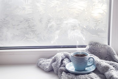 cozy soft gray blanket with a cup of coffee