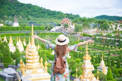 woman is enjoy traveling at  nongnooch garden in patthaya, thailand.