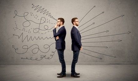 young conflicted businessman choosing between two directions with arrows and scribbles around him