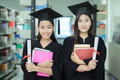 education graduation student success ,beautiful female teen asia high school student listen music in school,age 20-29 year old