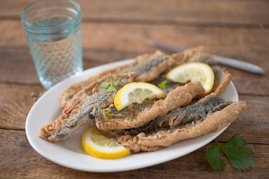 fried fish fillet with lemon slices
