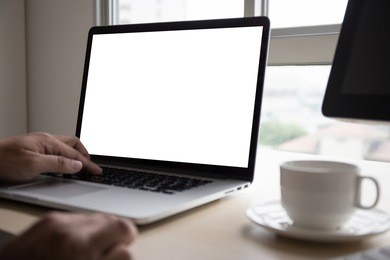 young man working businessman using a desktop computer of the blank screen