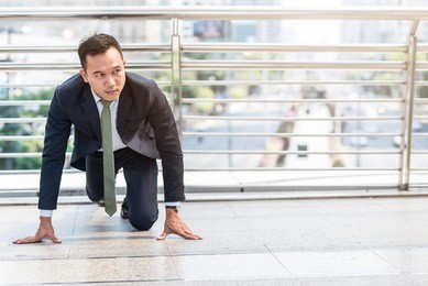 confident asian businessman ready to start his career or business with city in background. business start concept.