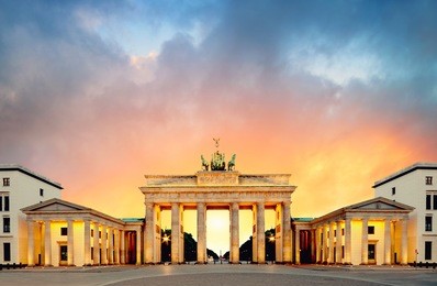 brandenburg gate (brandenburger tor) in berlin, germany, on a sunset, panoramic image